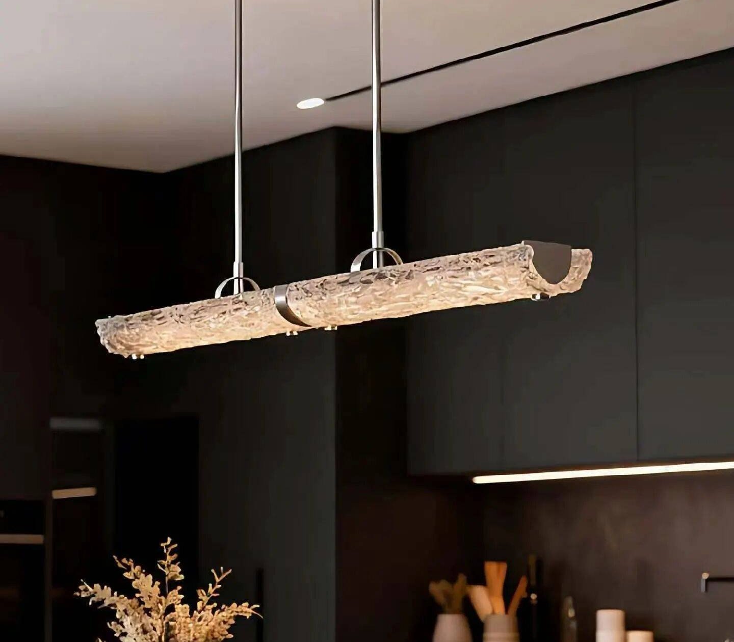 Bespoke alabaster linear pendant over dark kitchen island
