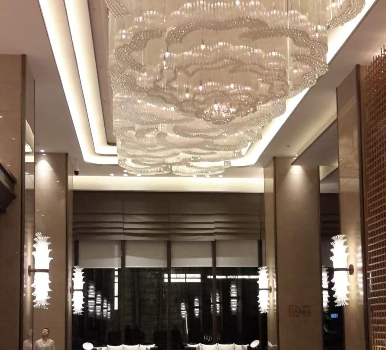Crystal cloud chandelier over hotel lobby